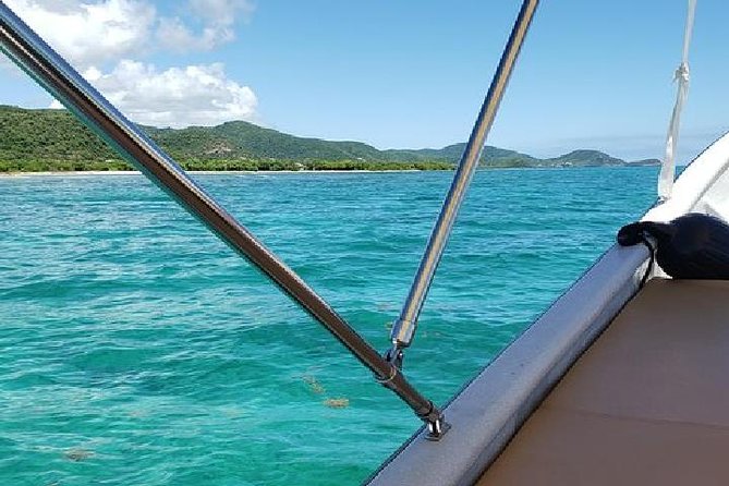 Snorkel and Exclusive Beach Exploration in Antigua - Local snacks, pineapple, and rum punch aboard